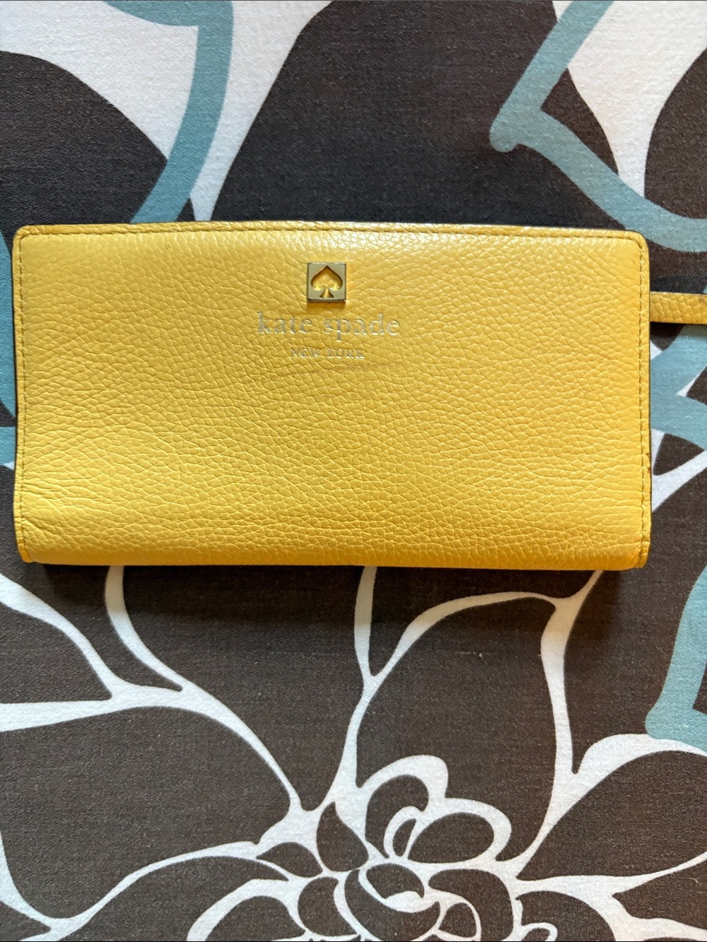 kate spade Yellow Pebbled Leather wallet with back zip